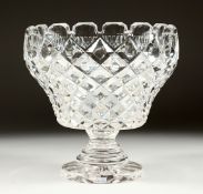 A LARGE WALSH SIGNED CUT GLASS PEDESTAL FRUIT BOWL, 9ins x 9ins