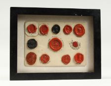 A COLLECTION OF TWELVE OLD WAX SEALS framed and glaze. 9.5ins x 7.5inS.