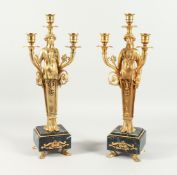 A VERY GOOD PAIR OF GILT BRONZE EMPIRE DESIGN, THREE LIGHT CANDLESTICKS with classical female, on