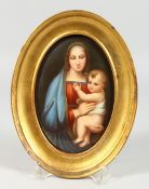 A GOOD OVAL PORCELAIN PLAQUE Madonna and child, in a gilt frame. 6 x 4 ins.
