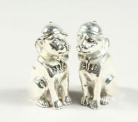 A PAIR OF .800 DOG SALT AND PEPPERS