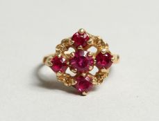 AN 18CT GOLD FIVE STONE RUBY CLUSTER RING