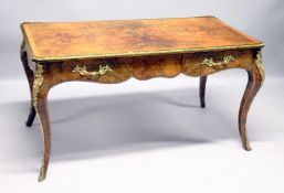 A GOOD LOUIS XVI STYLE FIGURES WALNUT BUREAU PLAT, with cross banded top , ormolu mounts , two freze