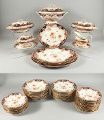 A GOOD CROWN DERBY JAPAN PATTERN DINNER SERVICE comprising 4 meat plates, 4 terrines, gravy boat, 24