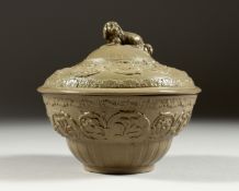 A GOOD GREEN SALT GLAZED BOWL AND COVER with dog handles. 5ins high