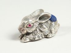 A LARGE SILVER RABBIT PIN CUSHION