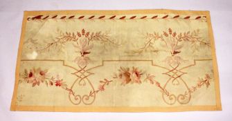 AN AUBUSSON PIECE OF TURKISH FABRIC with roses and scrolls 5ft x 2ft 9ins