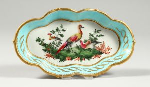A WORCEASTER SPOON TRAY, painted with birds under a turquoise and gilt border (gilding worn).