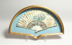 AN 18TH CENTURY FRENCH IVORY AND PAPER FAN, with young lovers and portraits . 17ins open, in a