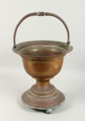A DUTCH COPPER JARDINIERE with swing handle. 1ft 3ins high