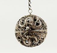 A CHINESE PIERCED BALL CENSER on a chain. 2ins diameter.