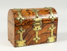 A VICTORIAN FIGURED WALNUT, BRASS MOUNTED, DOMED STATIONARY BOX 9ins long