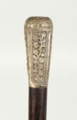 AN INDIAN ROSEWOOD CANE with silver handle. 35ins long.