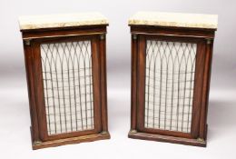 A GOOD PAIR OF REGENCY MAHOGANY PIER CABINETS with beige marble tops, brass grilled and pleated silk