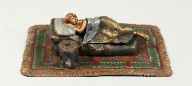 A VIENNA STYLE COLD PAINTED BRONZE OF A SLEEPING WOMAN on a Persian rug. 6ins long.