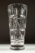 A LARGE WALSH SIGNED CUT GLASS VASE 10ins high.