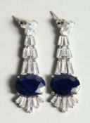 A PAIR OF SILVER LARGE SAPPHIRE DROP EAR RINGS