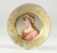 A SUPERB VIENNA PORCELAIN PLATE with a portrait of TUGEND, signed Enitsche with a lustre border. 9.