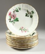 A SET OF TEN WEDGWOOD CIRCULAR BOTANICAL PLATES, each painted with flowers. Wedgwood mark in red