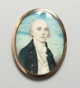 AN 18TH CENTURY GOLD MOUNTED OVAL MINIATURE PORTRAIT half length of a man, the reverse with plated