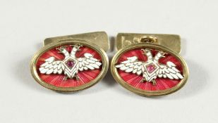 A PAIR OF RUSSIAN AND ENAMEL CUFF LINKS with Faberge mark.