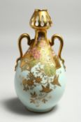 A GOOD M. REDON, LIMOGES TWO HANDLED VASE, with flowers and birds in gilt. Circular printed mark no.