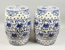 A PAIR OF CHINESE BLUE AND WHITE GARDEN SEATS. 17ins high.
