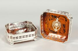 A PAIR OF PLATE AND FAUX TORTOISE SHELL SQUARE WINE COASTERS