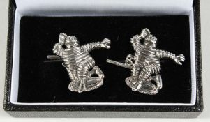 A PAIR OF SILVER MICHELIN MAN CUFF LINKS.