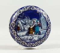 A BLUEGLASS CIRCULAR BOX AND LID with enamel decoration at the well. 7ins diameter.