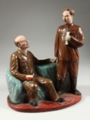 A RUSSIAN PORCELAIN GROUP OF LENIN AND a Chinese general holding a pipe, one standing the other