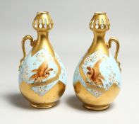 A GOOD PAIR OF M. REDON, LIMOGES SINGLE HANDLED BULBOUS VASES, gilt and blue ground painted with