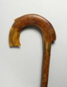A VICTORIAN WALKING STICK with carved horn handle in the shape of a carp. 36ins long.