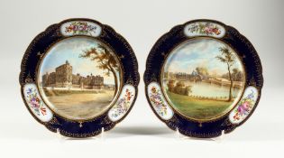A SUPERB PAIR OF SEVRES PORCELAIN PLATES, the blue borders with vignettes of flowers, the centres