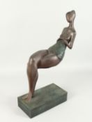 AN ABSTRACT BRONZE SEATED LADY on a rectangular base. 24ins high.