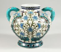 A POTTERY TWIN HANDLED BOULBOUS VASE, in the William de Morgan Isnik style, decorated with