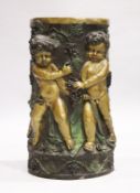 A GOOD TWO COLOUR BRONZE CIRCULAR STAND with Bacchanalian cherubs, square marble top. 2ft 6ins