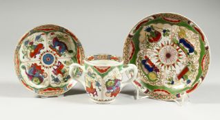 A WORCESTER CHOCOLATE CUP with entwined handles, with stand painted in the Kylin or Dragon in