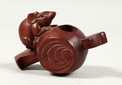 A JAPANESE CARVED WOOD TWO HANDLED VESSEL with a rat. 3.5ins long.