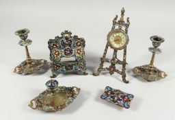 A FRENCH CHAMPLEVE ENAMEL SIX PIECE DESK SET, comprising clock, inkstand, pair of sticks, blotter