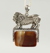 A SILVER AGATE SWIVEL FOB on a chain.