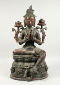 A LARGE CHINESE BRONZE SEATED GOD Signed, 26ins high.