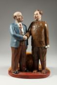A RUSSIAN PORCELAIN GROUP OF LENIN AND A CHINESE GENERAL holding a pipe, possibly General Wei