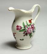 A WORCESTER FAMILLE ROSE JUG, painted with flowers. 3.5ins high.