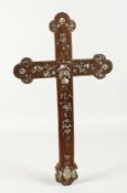 A 19TH CENTURY ROSEWOOD CROSS inlaid with mother of pearl. 18ins long.