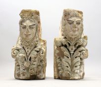 A PAIR OF MEDIEVAL CARVED SANDSTONE CORBELS, each carved with female faces, one with a column