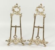 A PAIR OF GILT METAL PICTURE EASLES 15ins high.