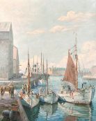 Robert Panitzsch (1879-1949) Danish, fishing boats moored on a quay with a city beyond, probably
