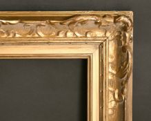 An early 20th century carved wood frame, rebate size 16