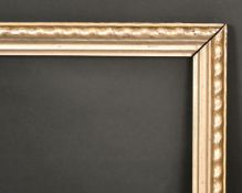 A 19th century carved wood frame, rebate size 25.75